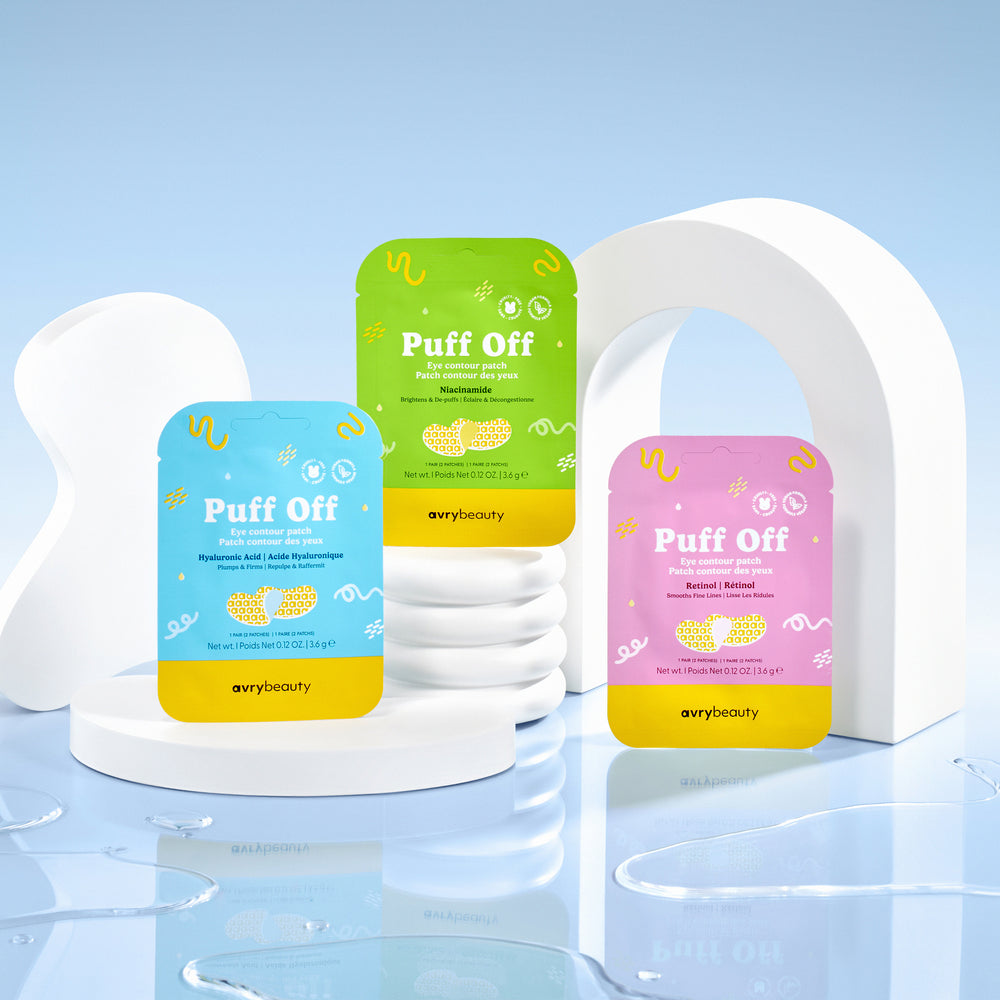Three 'Puff Off' face mask packages in different colors on a white stand with a blue gradient background.